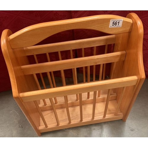 561 - A large wooden magazine rack