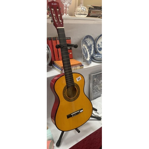 569 - A 3/4 size acoustic guitar (Stand not included)