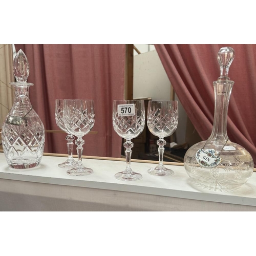 570 - 2 Vintage decanters & A set of 4 wine glasses