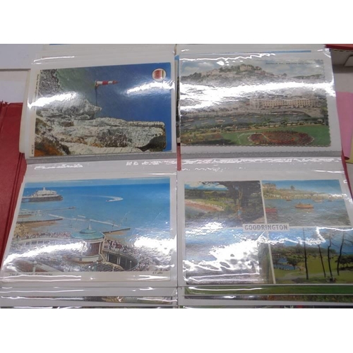 113 - Two albums of approximately 350 mainly topographical postcards.