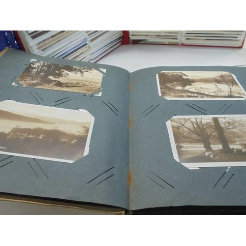 113 - Two albums of approximately 350 mainly topographical postcards.