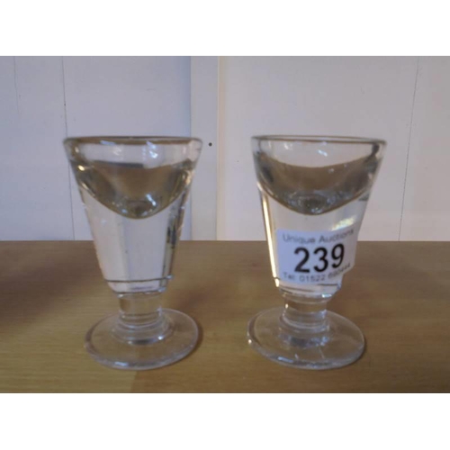 239 - Two Victorian glass 'Penny Lick' glasses.