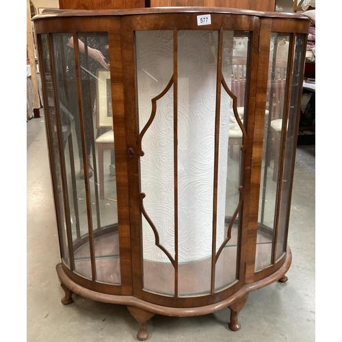 577 - A bow fronted Astral glazed China cabinet with two shaped glass shelves on Queen Anne style legs 120... 