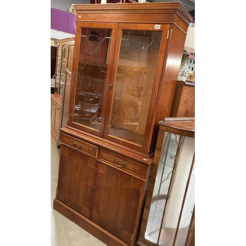 578 - A reproduction mahogany effect display dresser, glazed etched doors with two drawers and cupboards u... 