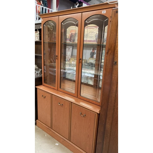 581 - A teak effect part glazed dresser, Etched glass, interior lighting and mirror back with internal dra... 