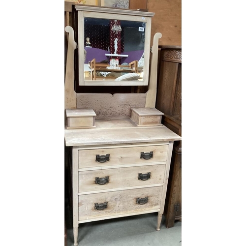 588 - A mirrored dressing table with 3 drawers and two trinket boxes on short turned legs 160 x 76 x 45cm