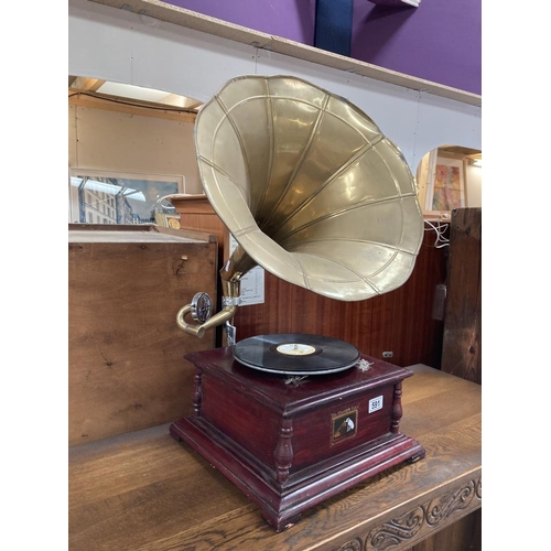 591 - A 20th century replica of a horn gramophone with brass horn