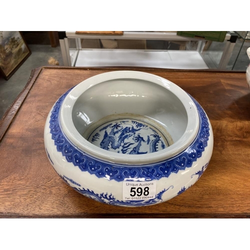 598 - A Chinese blue & white dragon decorated bowl. (4 character mark to bottom)