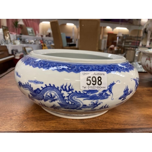 598 - A Chinese blue & white dragon decorated bowl. (4 character mark to bottom)