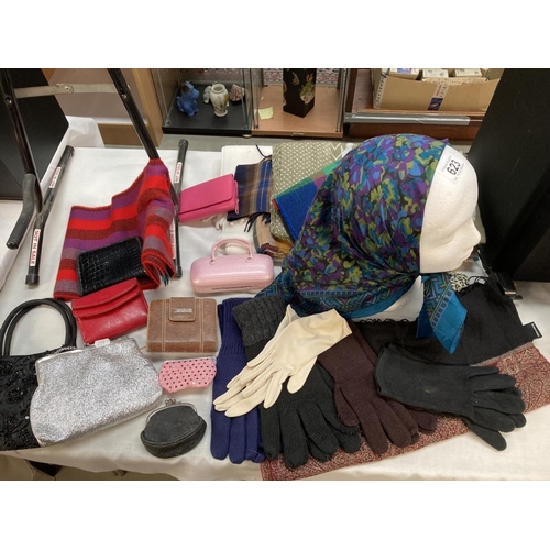 623 - A selection of scarfs, gloves, purse bags etc