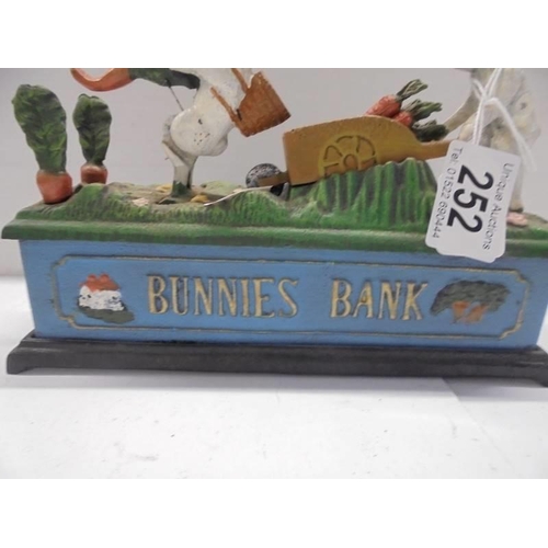 252 - A cast iron Bunnies money bank.