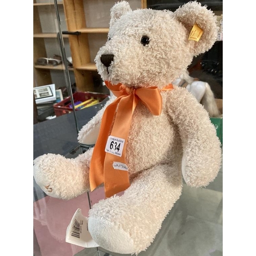 634 - A Steiff bear with orange ribbon