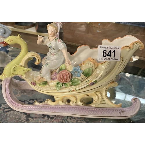 641 - A Porcelain lady in swan carriage