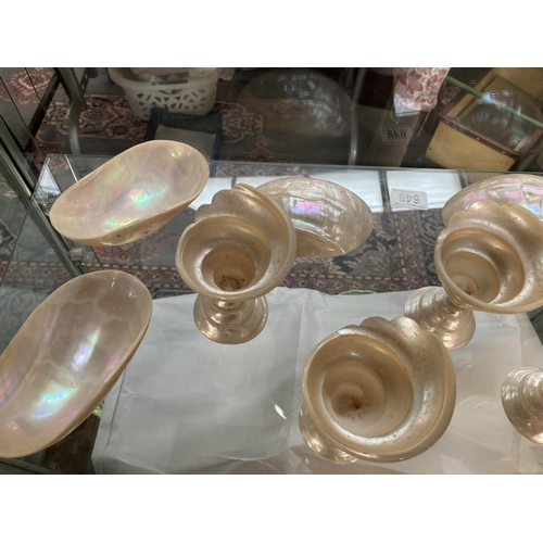 648 - A quantity of mother of pearl shell goblets & bowls