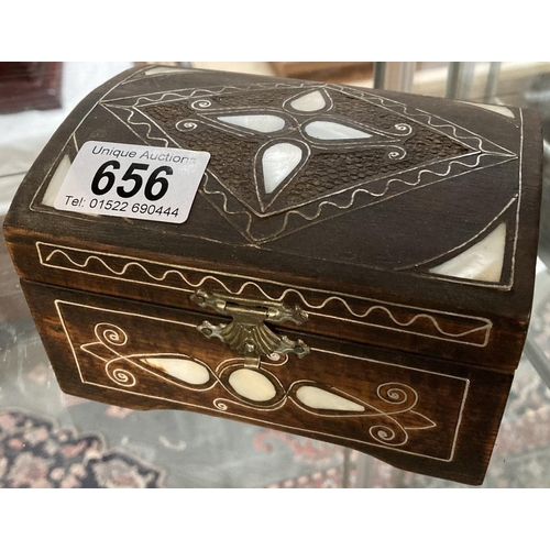 656 - A Hardwood jewellery casket with mother of pearl & white metal inlay & contents including cufflinks ... 