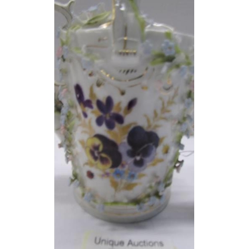 262 - A superb antique porcelain watering can encrusted with flowers.