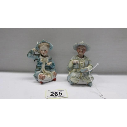 265 - A pair of 19th century porcelain Chinese nodding head figures.