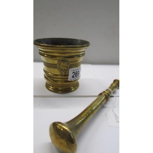 269 - A brass pestle and mortar