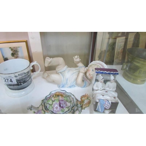 274 - A mixed lot including piano baby, 2 Victorian fairings, small teapot and a Blackpool mug.