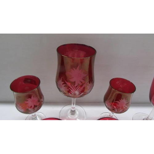 283 - Six items of cranberry glass.