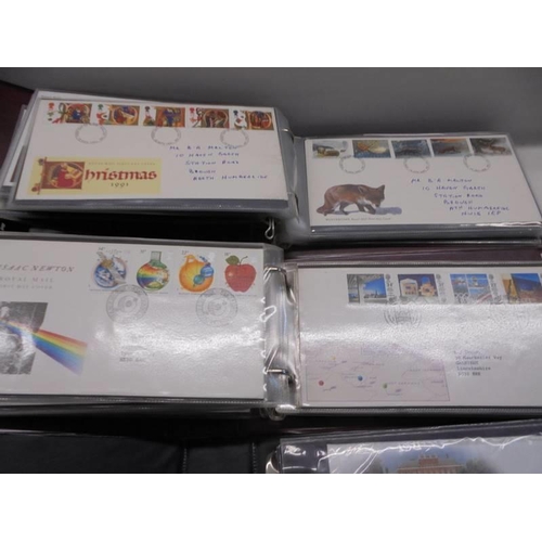 119 - Three albums of Royal Mail first day covers.