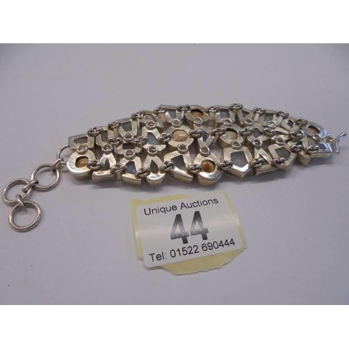 44 - A silver stone set three row bracelet.