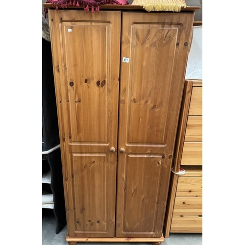 811 - A solid pine double door wardrobe