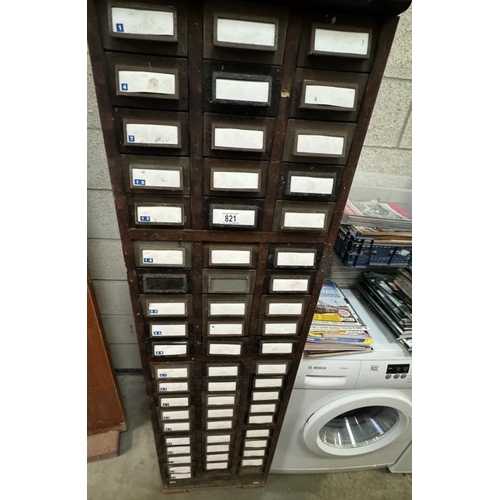 821 - A tall wood framed cabinet of metal card filing drawers 45 x 64 x 162cm