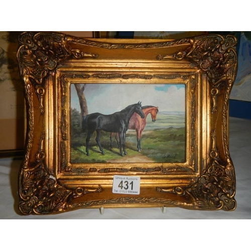 431 - A gilt framed study of horses,