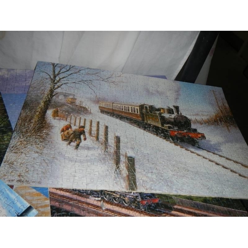 442 - Approximately ten completed steam engine jigsaw puzzles, COLLECT ONLY.