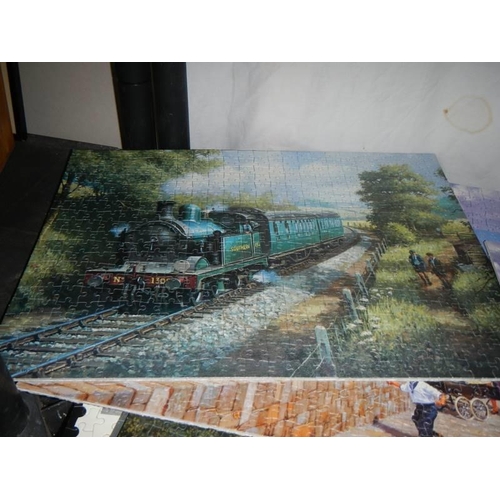 442 - Approximately ten completed steam engine jigsaw puzzles, COLLECT ONLY.