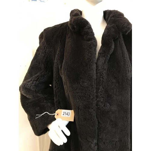 2143 - A vintage Fur coat with metal fastening with hand stitching. AF