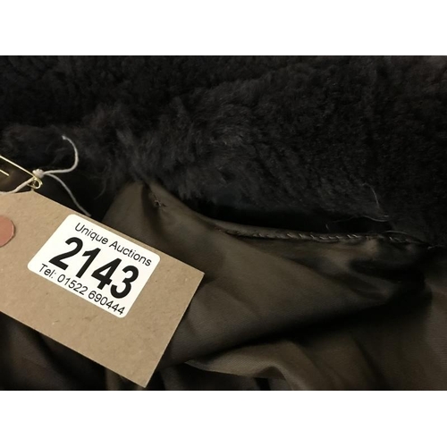 2143 - A vintage Fur coat with metal fastening with hand stitching. AF