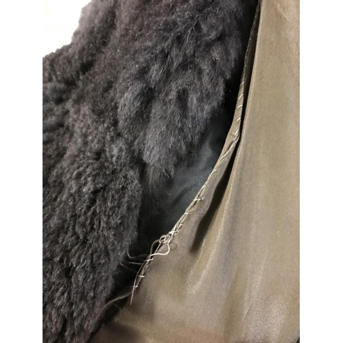 2143 - A vintage Fur coat with metal fastening with hand stitching. AF