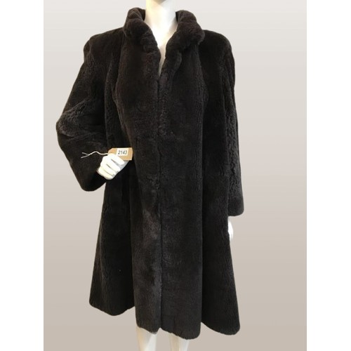 2143 - A vintage Fur coat with metal fastening with hand stitching. AF