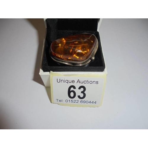 63 - A Colonia silver and amber dress ring, size Q.