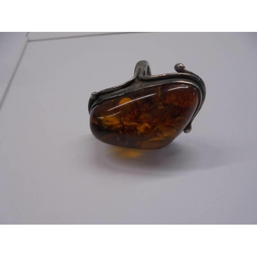 63 - A Colonia silver and amber dress ring, size Q.