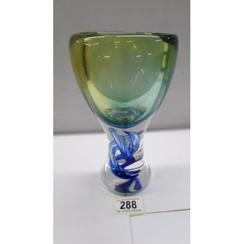 288 - A good heavy studio glass vase with twist in stem.