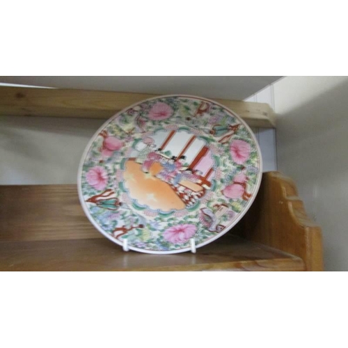 298 - A 19th century Chinese dish and two Chinese plates.