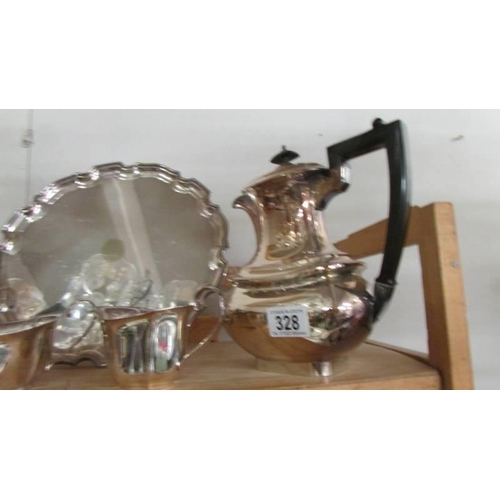 328 - A four piece silver plate teaset with tray.