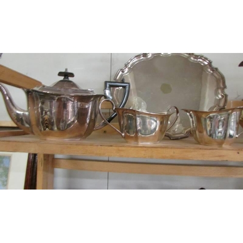 328 - A four piece silver plate teaset with tray.