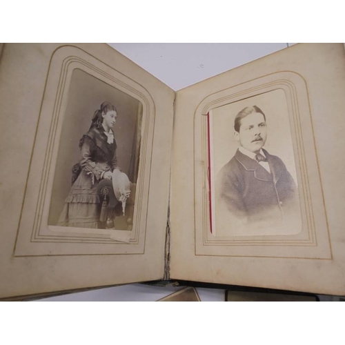 84 - A small Victorian photo album (spine needs repair) and loose photographs.