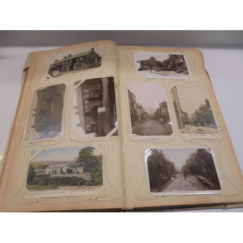 86 - An album of approximately 150 early 20C postcards and a scrap book mainly relating to the Bronte's.