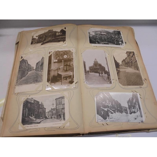 86 - An album of approximately 150 early 20C postcards and a scrap book mainly relating to the Bronte's.