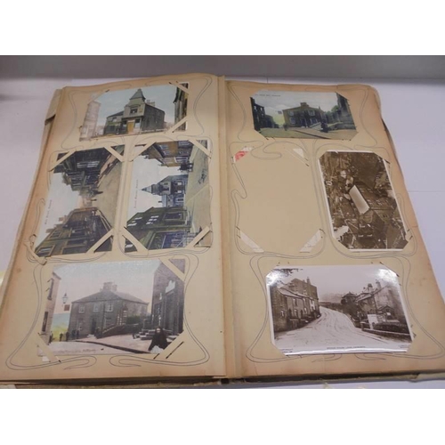 86 - An album of approximately 150 early 20C postcards and a scrap book mainly relating to the Bronte's.