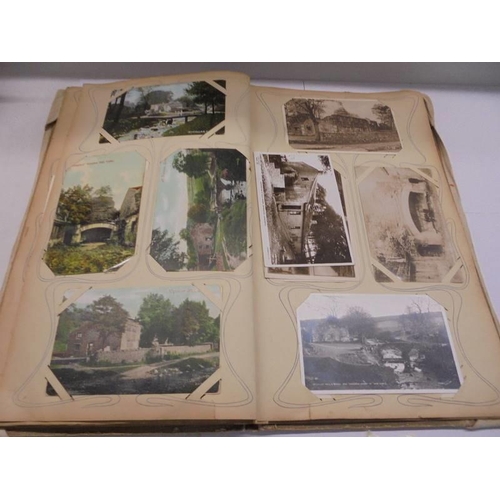 86 - An album of approximately 150 early 20C postcards and a scrap book mainly relating to the Bronte's.