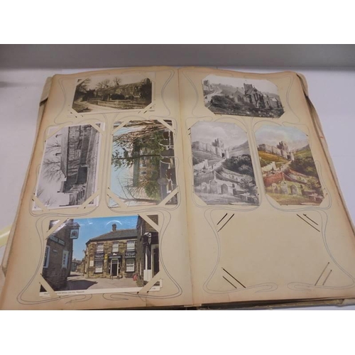 86 - An album of approximately 150 early 20C postcards and a scrap book mainly relating to the Bronte's.