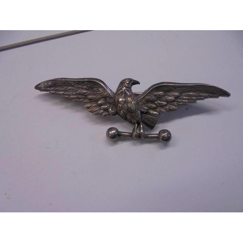 88 - An eagle badge and one other.