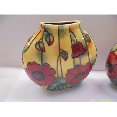 91 - A pair of Old Tupton ware poppy vases.