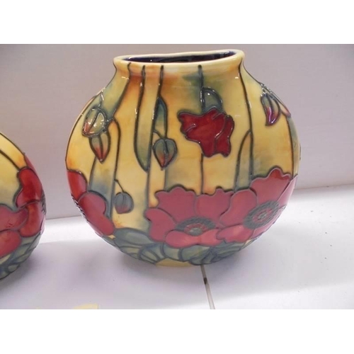 91 - A pair of Old Tupton ware poppy vases.